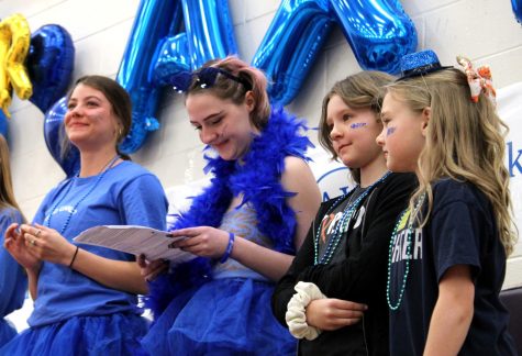 Second from right, Braxton Brown, watches a performance at the Spread the Love Week assembly last spring. With the financial support provided to them by FCHS, Braxton and her family are preparing to visit Hawaii over Thanksgiving Break. SPILLED INK FILE PHOTO