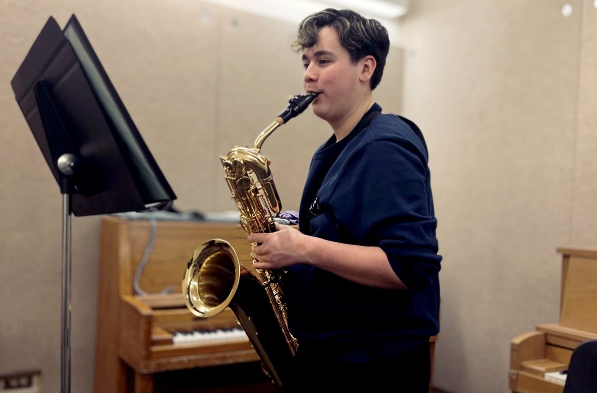 Practicing+for+upcoming+performances%2C+freshman+Brendan+McKellar+plays+The+Sea+Between+on+baritone+saxophone.+The+FCHS+Saxophone+Quartet+and+Saxophone+Trio+will+play+on+April+21+and+29.
