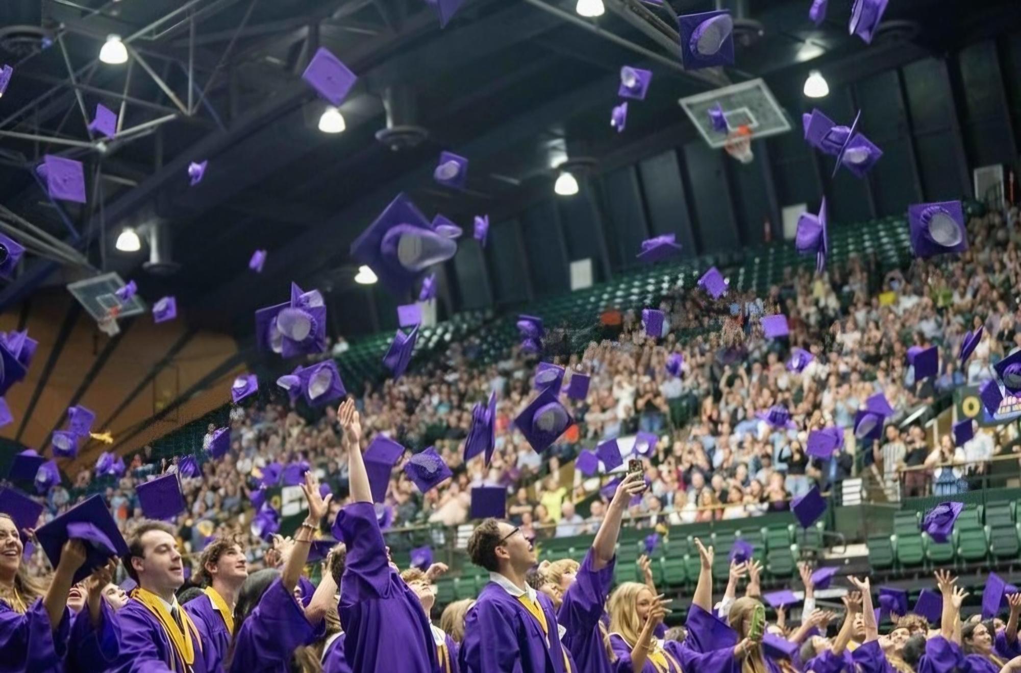 The class of 2024 tosses their caps into the air to celebrate graduation. Spilled Ink asked members of the graduating class to share advice for their freshman selves. Photo courtesy of PSD 