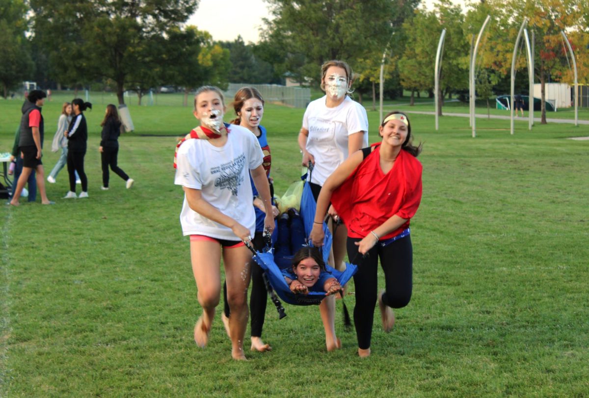 A team races a "bed" during Homecoming week in 2022.             Spilled Ink file photo