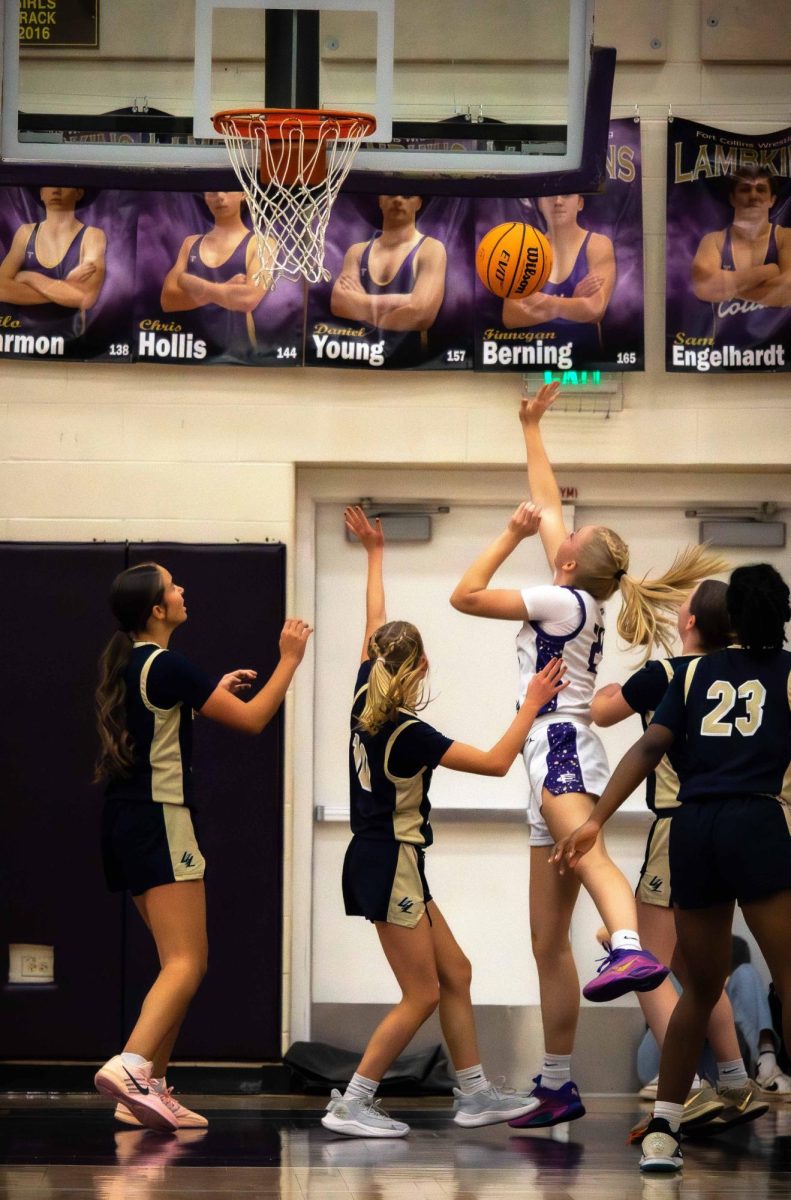 In a regular season game, Annika Van Dalen goes up for a shot against multiple defenders. Tomorrow, the varsity girls basketball team returns to the Sweet 16 for the first time in 12 years. They will face the Warriors at Arapahoe High School at 5:30 p.m.